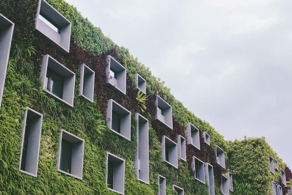 a building covered in real plants